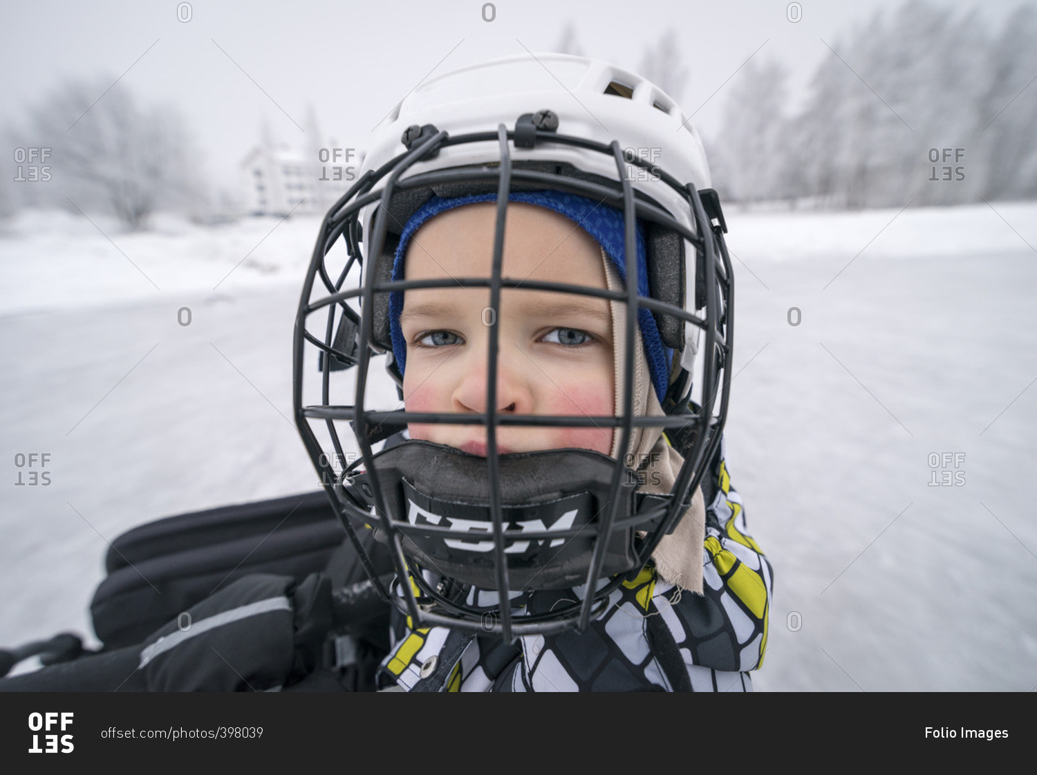 Finland, Pohjois-Pohjanmaa, Oulu, Portrait of boy in ice hockey helmet