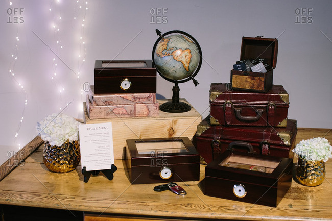 Close Up Of Table Arranged With Boxes Of Cigars For Wedding