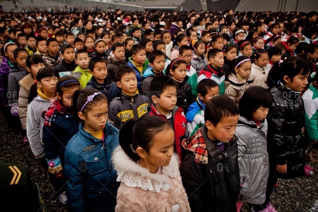 Nanjing, China - December 13, 2012: Chinese children lined up at the Nanjing Massacre Memorial Hall to commemorate the 75th anniversary of the Nanjing Massacre
