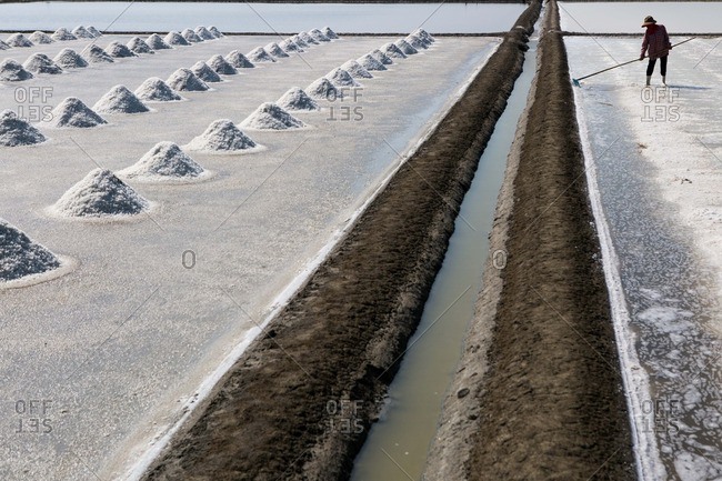 A salt field being harvested in Thailand