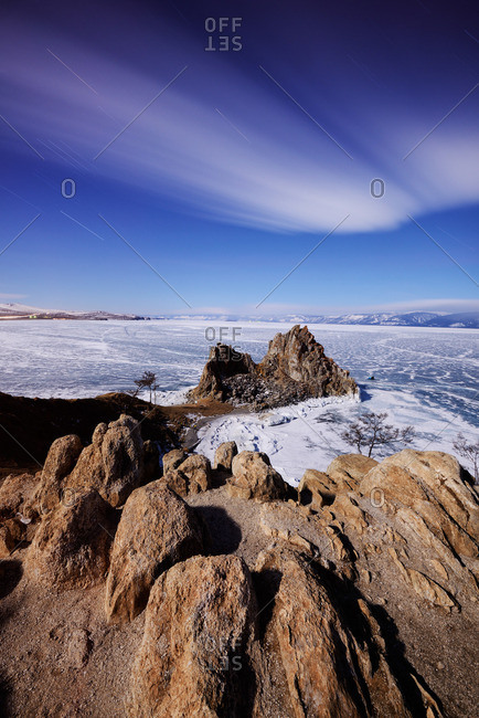 Distant view of Shamanka Rock on Burkhan Cape, Baikal Lake, Olkhon Island, Siberia, Russia