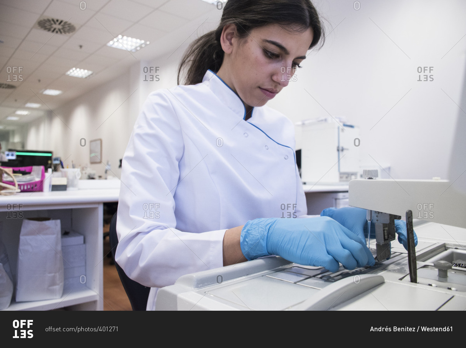 Laboratory technician in analytical laboratory preparing paraffin mold