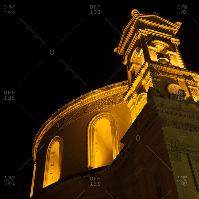 Close up of rotunda of Mosta lit up at night