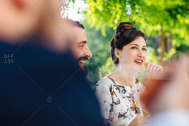 Group of friends having meal together outside