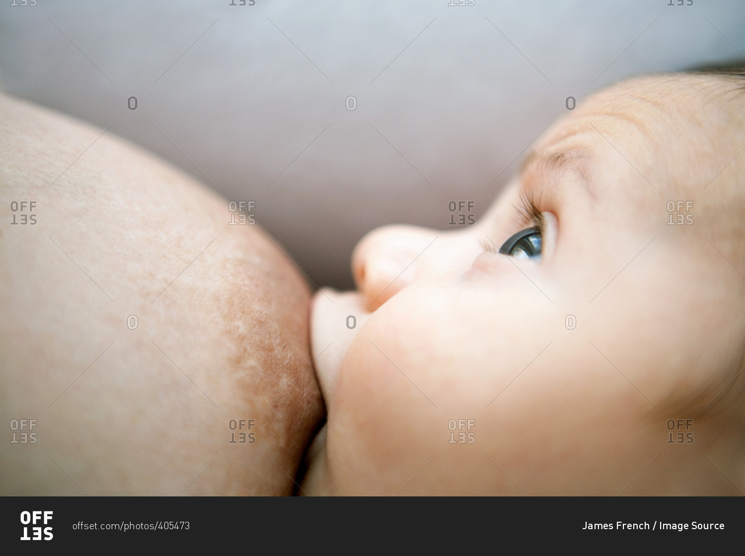 Close up of a baby breast feeding stock photo - OFFSET