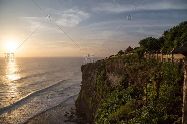 Cliff trail over sunlit ocean