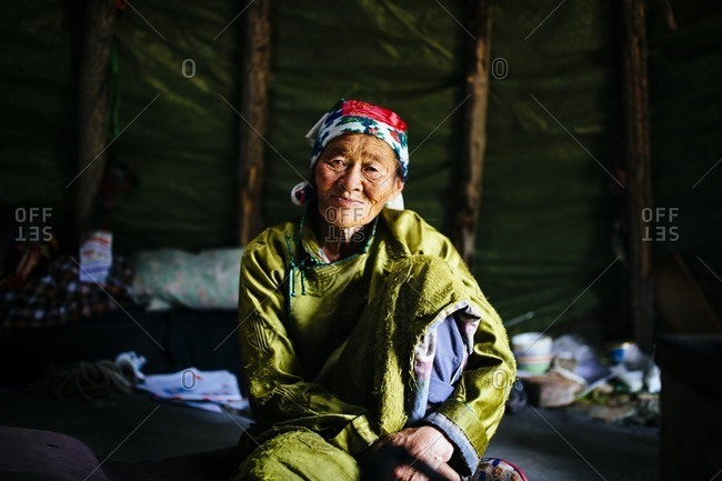 Mongolia - July 12, 2016: A portrait of an elder Tsaatan woman in the East Taiga of northern Mongolia