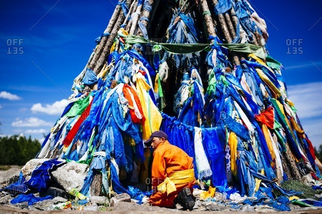 Mongolia - July 16, 2016: Traditional prayer flags adorn a religious site in northern Mongolia