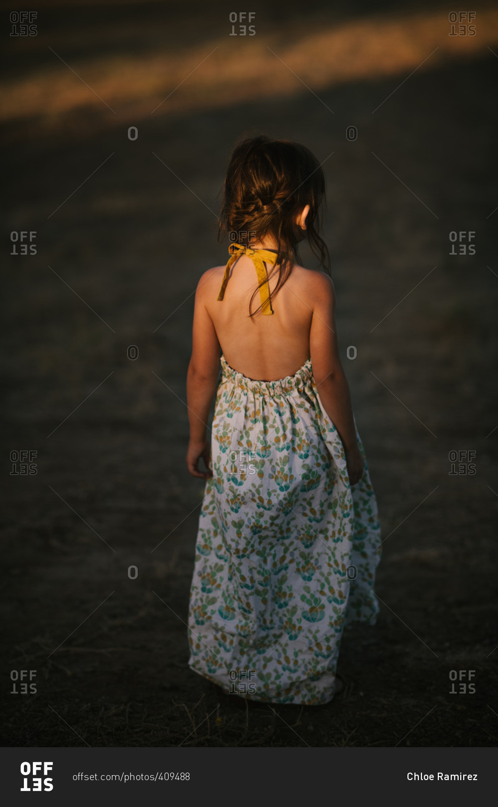 Little girl standing in sunset light wearing summer dress stock photo ...