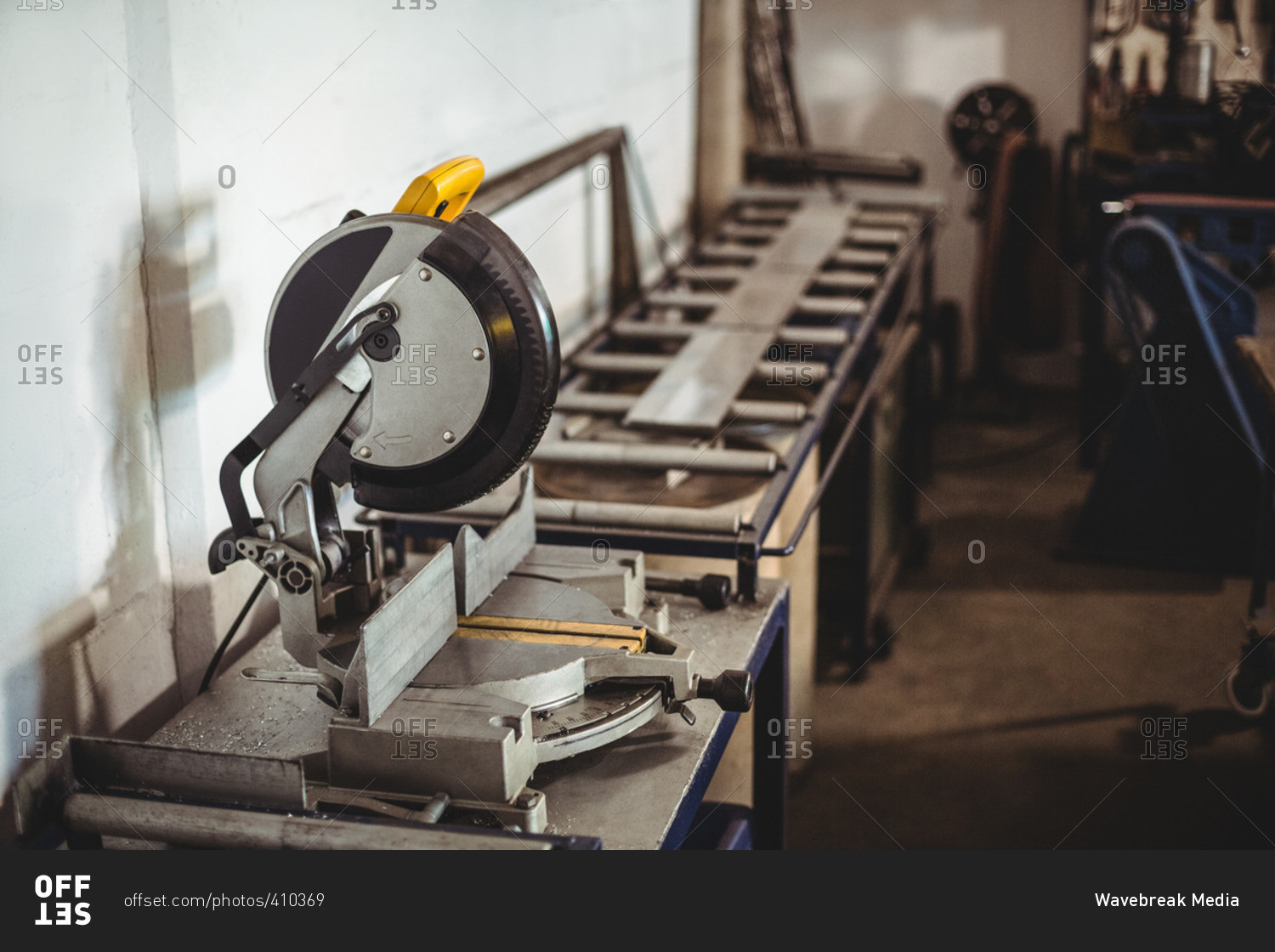 Circular saw machine on a table in stock photo OFFSET