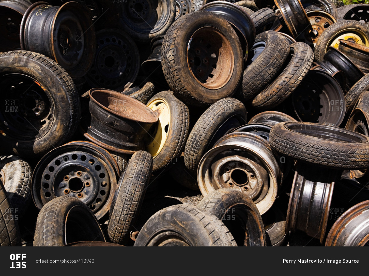 Scrap car tires and rims stock photo OFFSET
