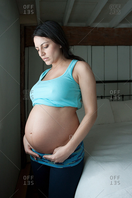Woman showing pregnancy bump - Offset