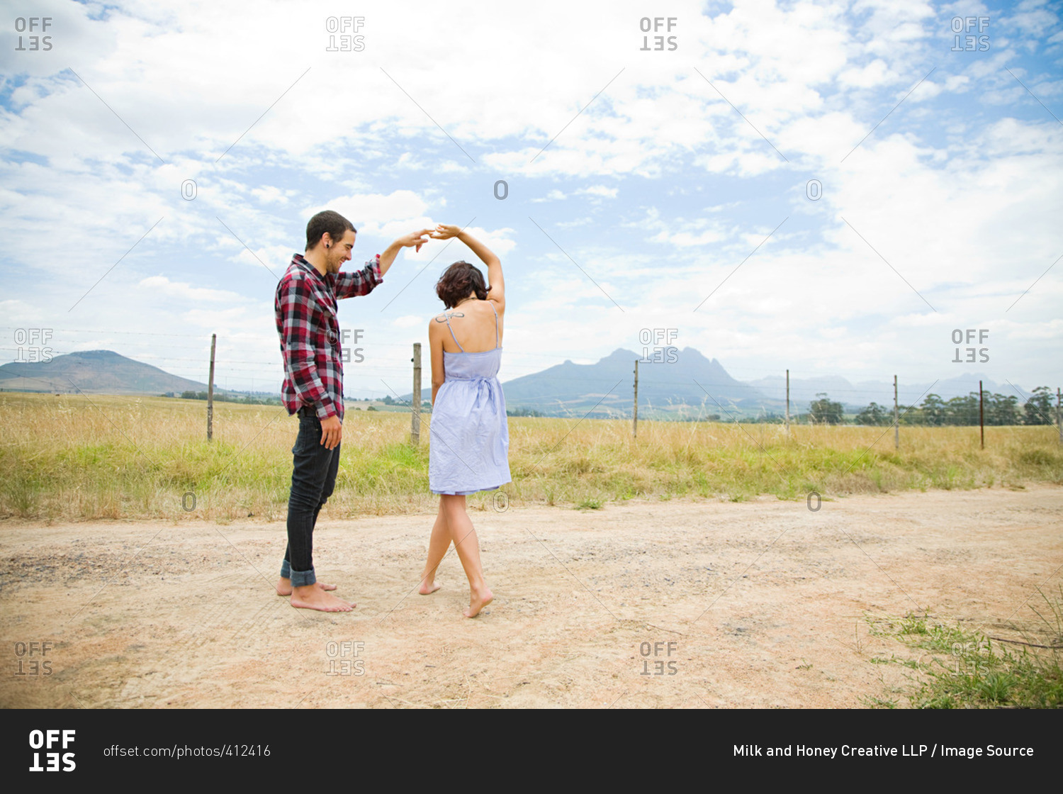 Couple dancing in a field