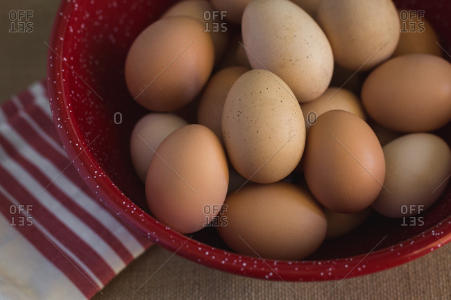 Brown eggs piled in a bowl