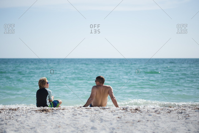 Father and son enjoying beach together