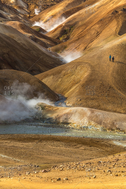 People hiking in the Icelandic geothermal landscape in the remote Kjoslur highlands