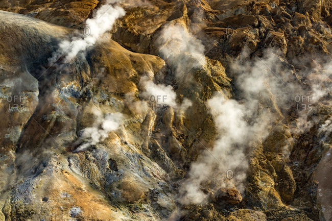 Steam rising from mountainside in Icelandic geothermal landscape in the remote Kjoslur highlands