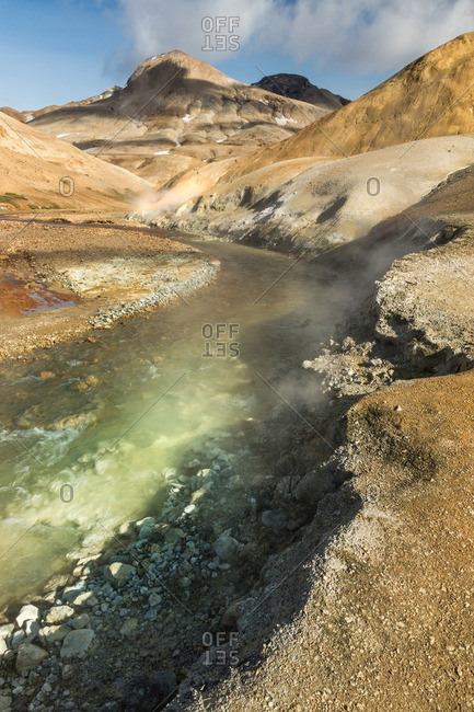 River and fumaroles in Icelandic geothermal landscape in the remote Kjoslur highlands