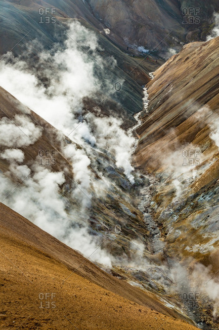 Steam rising from canyon in Icelandic geothermal landscape in the remote Kjoslur highlands
