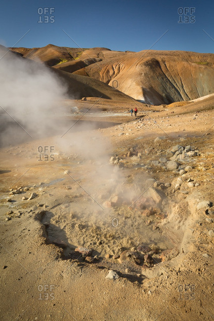 People hiking in Icelandic geothermal area in the remote Kjoslur highlands