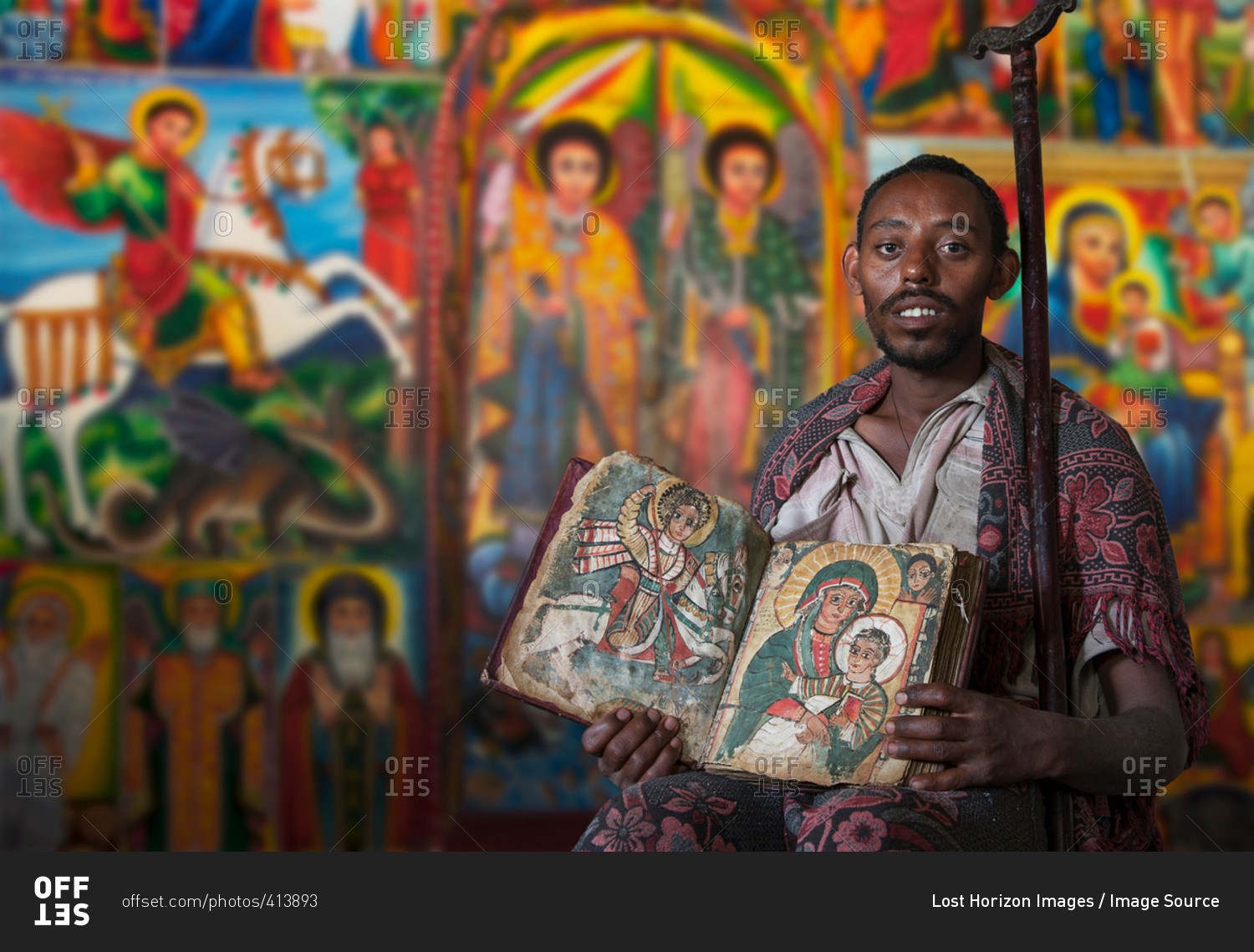 Priest showing an ancient religious book in an Orthodox Monastery, Tigray, Ethiopia