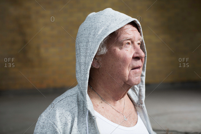 Man wearing hooded top looking away