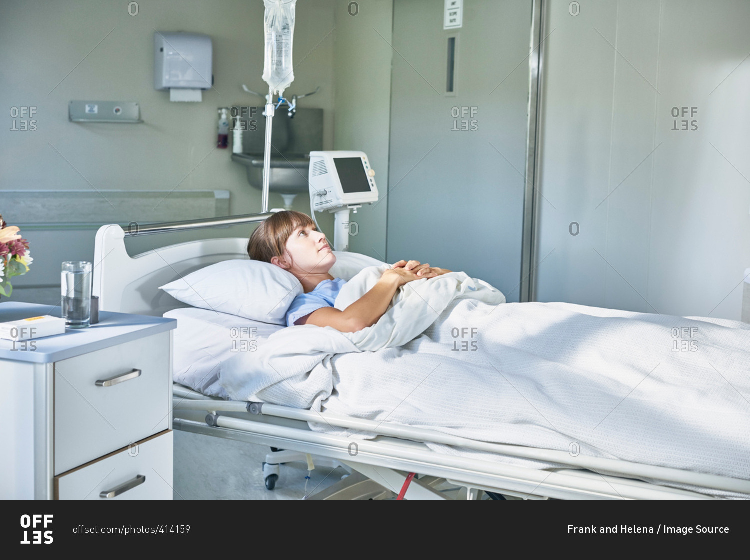 Woman laying down in hospital bed