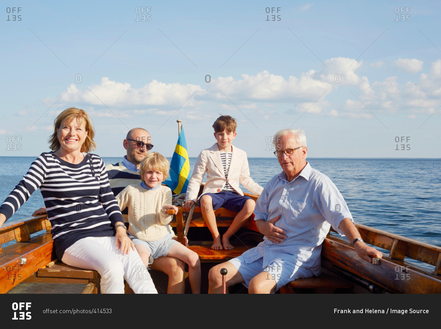 Family on boat looking at camera smiling