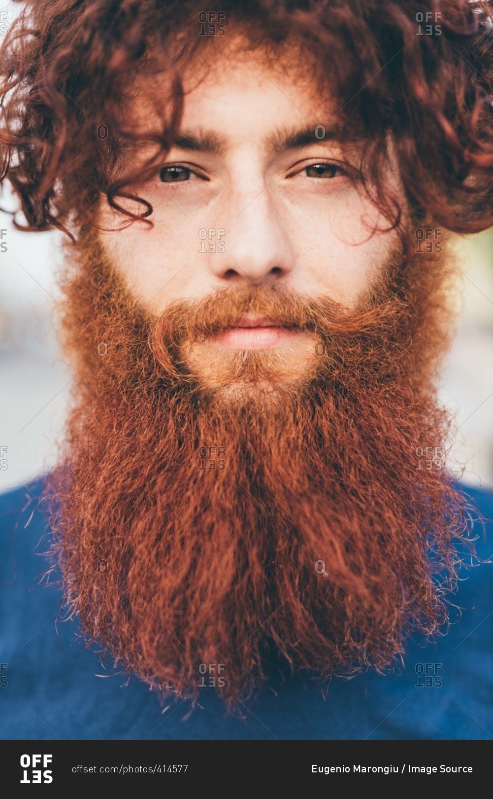 Close up portrait of young male hipster with red hair and beard
