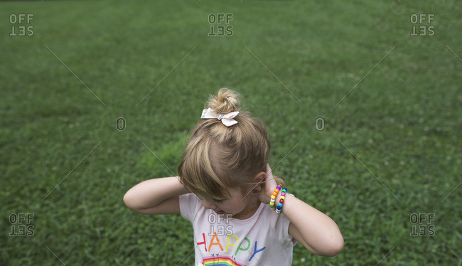 Cute young girl with her hair in a bun