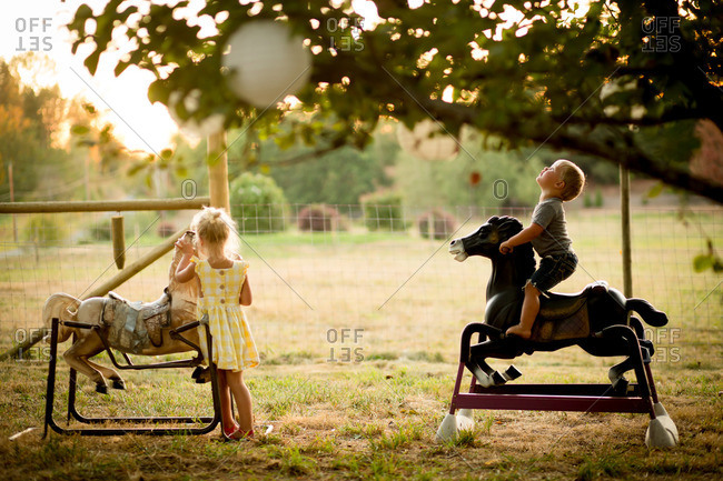 Boy playing on bouncy horses