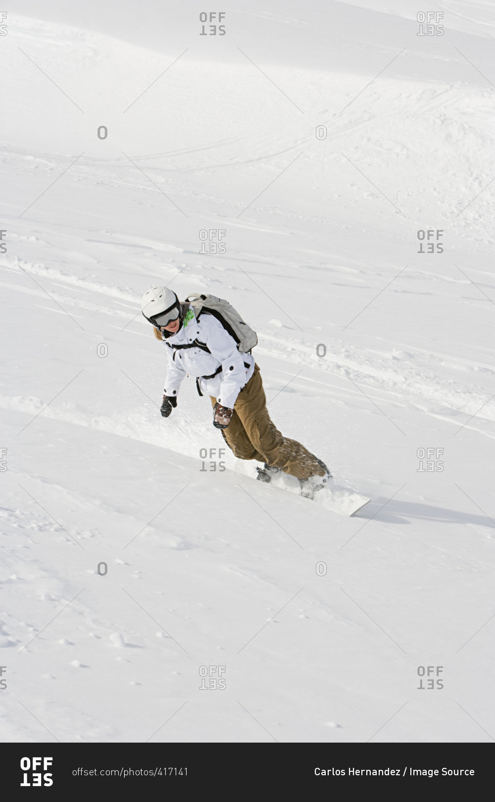 A woman snowboarding