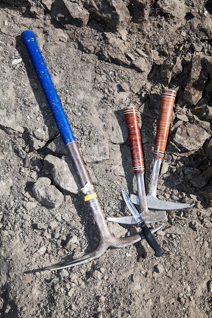 Still life of paleontology tools and pickaxes