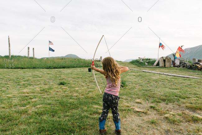 Little girl practicing archery - Offset