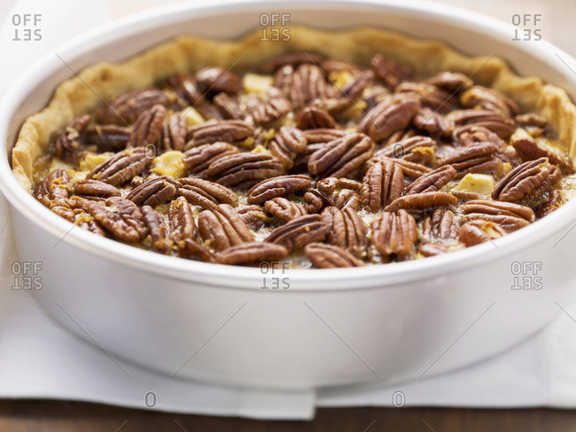 Pecan and apple pie in pie dish