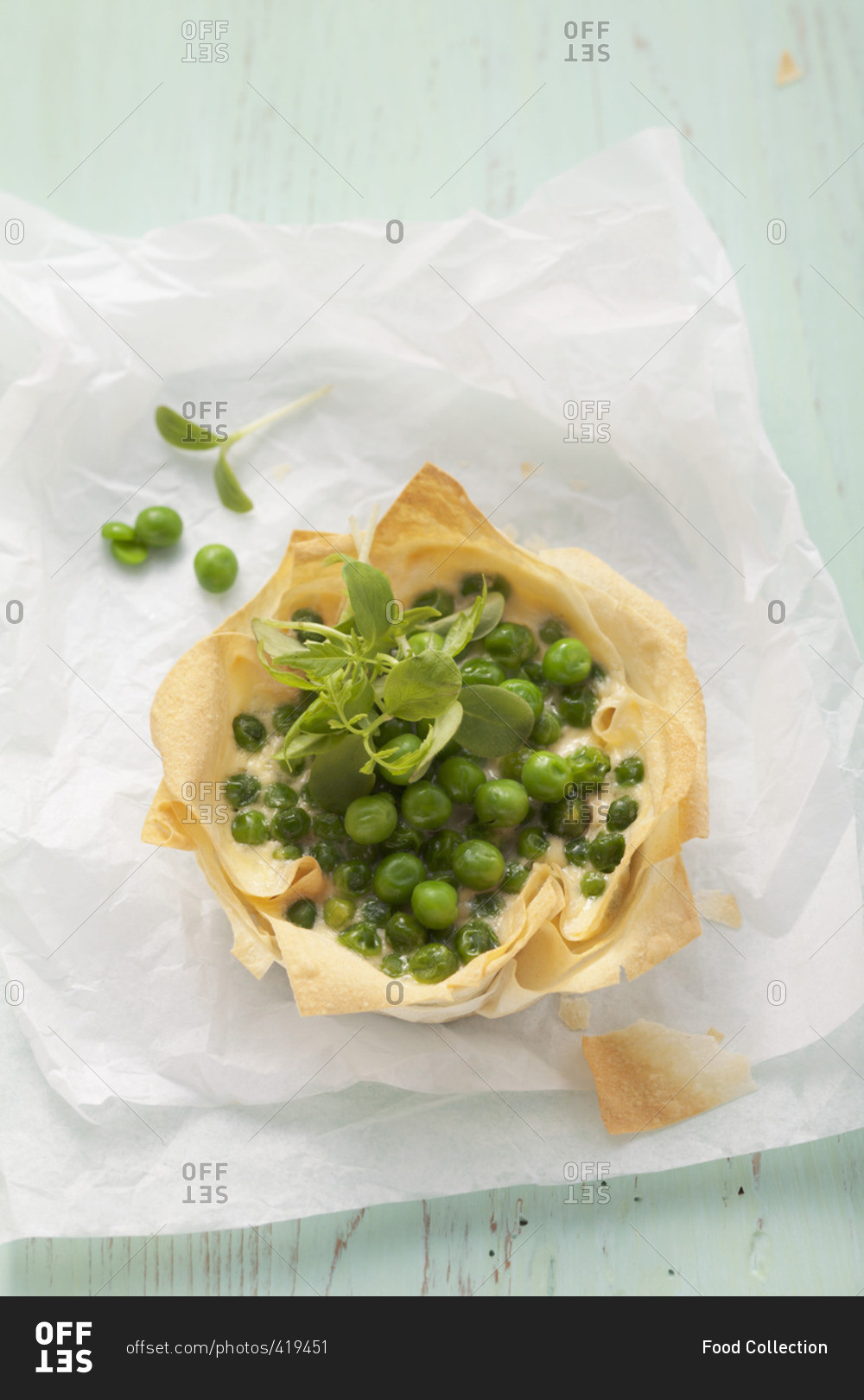 A puff pastry dish filled with peas