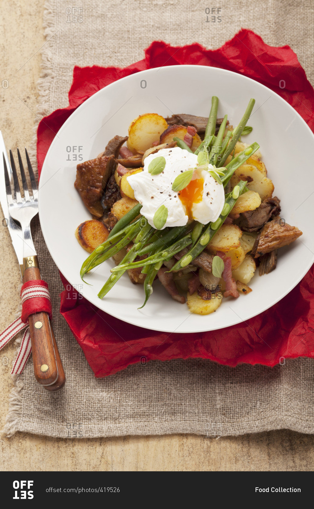 (typical Tirolean dish using leftovers) with potatoes, pork, green beans and a poached egg