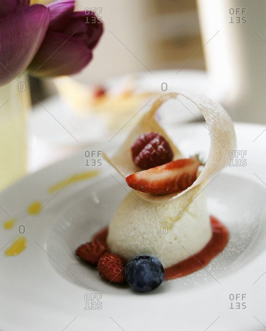 Yoghurt mousse with fresh berries and fruit sauce