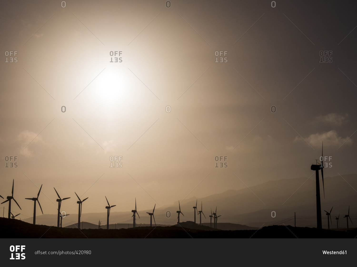 Spain, Tenerife, wind turbines at backlight