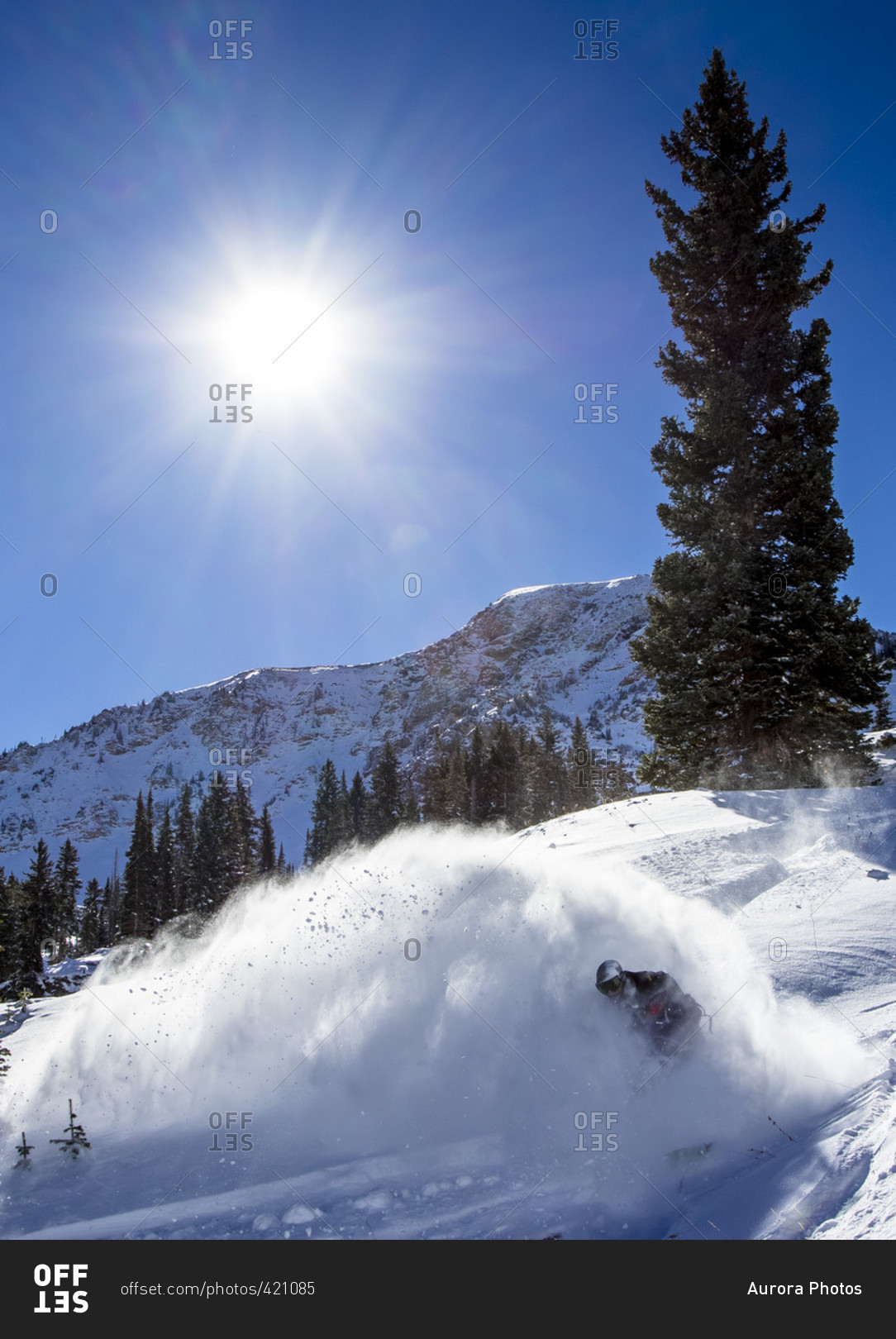 A Man Snowboarding In Little Cottonwood Canyon In Utah