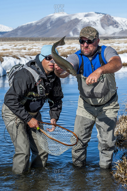 Two Fishermen Trying To Catch A Rainbow Fish On The Upper Owens River