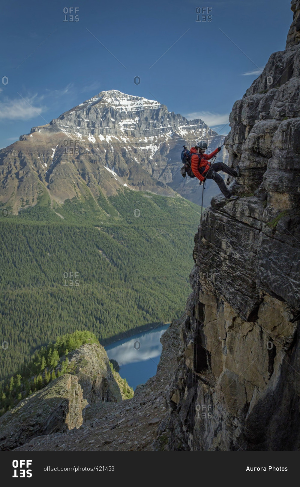 Person Climbing Down Mount Temple In Alberta, Canada