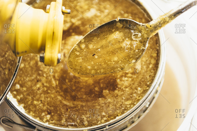 Spoonful of product from honey harvest
