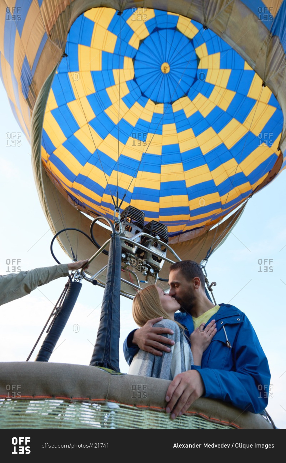Young couple kissing in hot air balloon