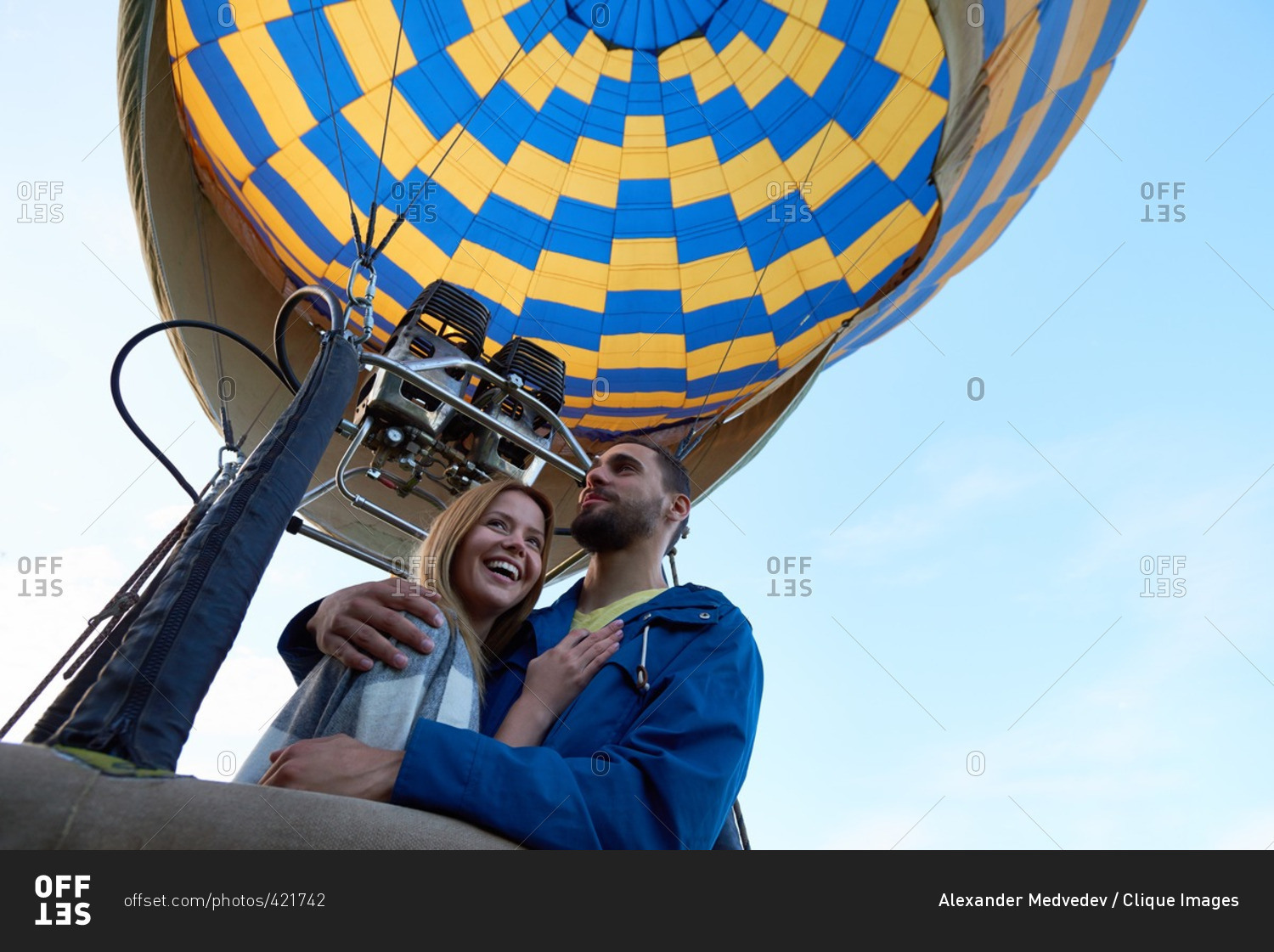 Happy couple having romantic date in hot air balloon