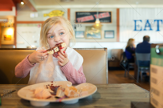 Girl eating messy dessert