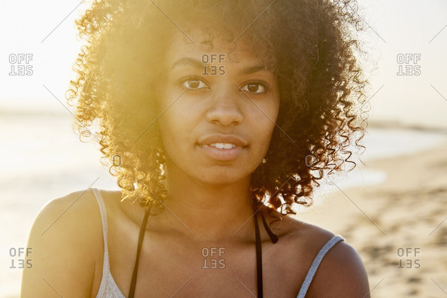 Portrait of an African American woman against a sunlit background