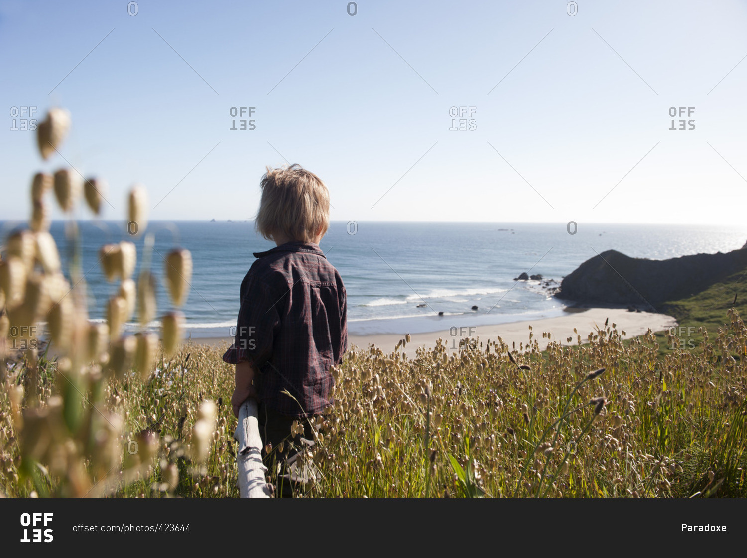 Child looking at tranquil beach view