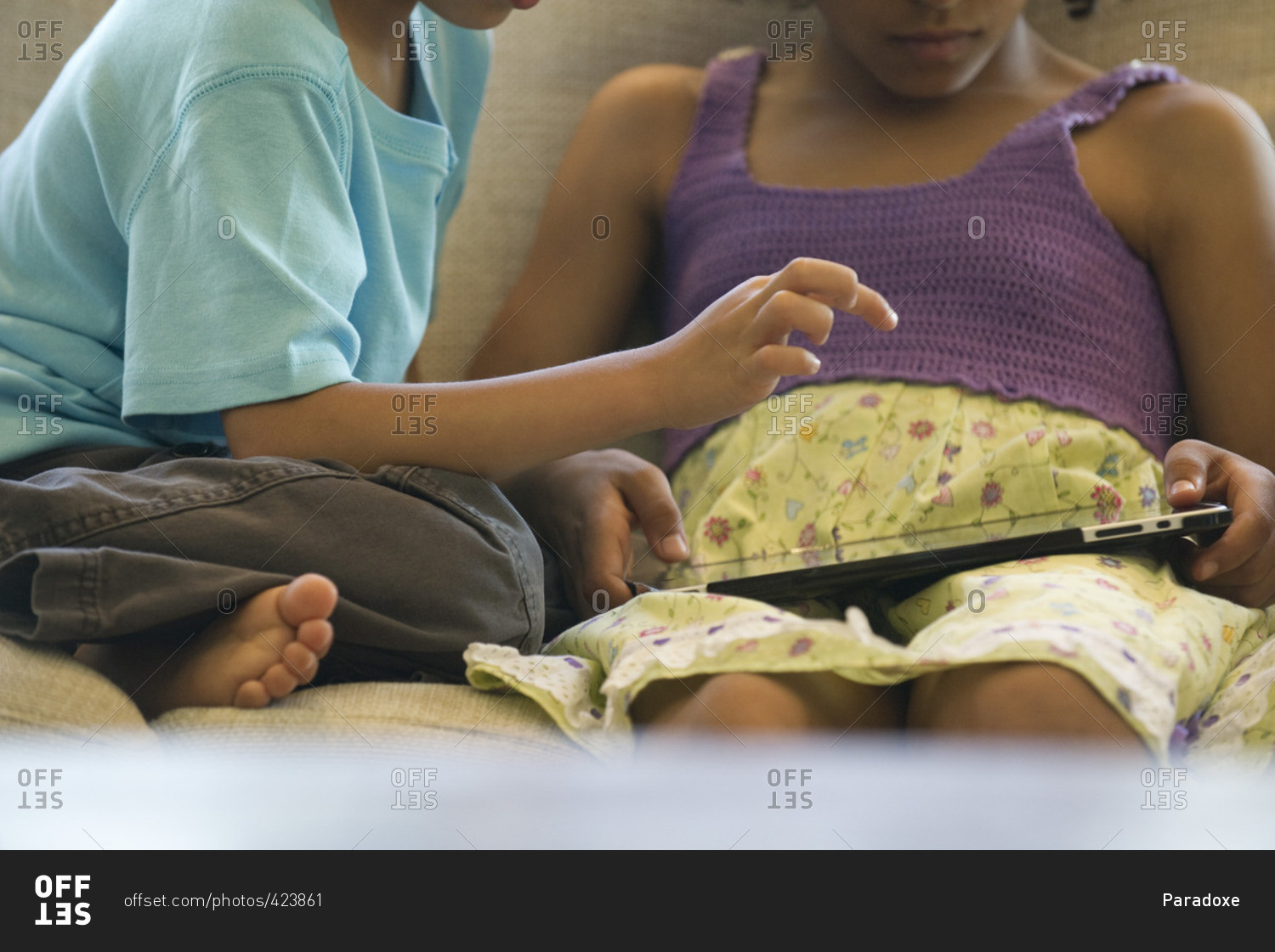 Children using digital tablet, cropped