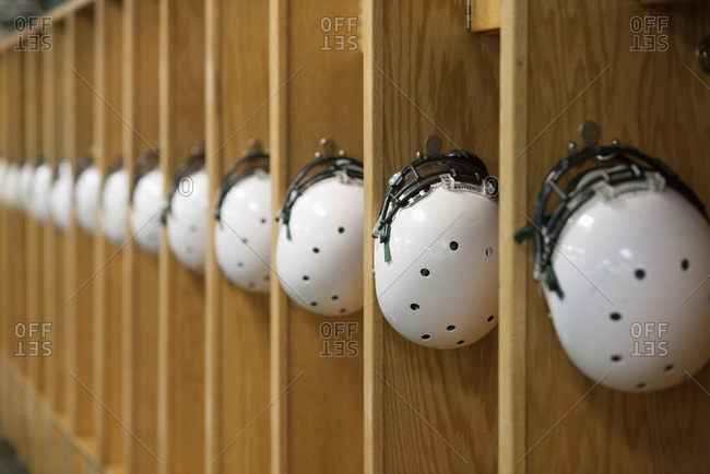 Helmets hanging in locker room